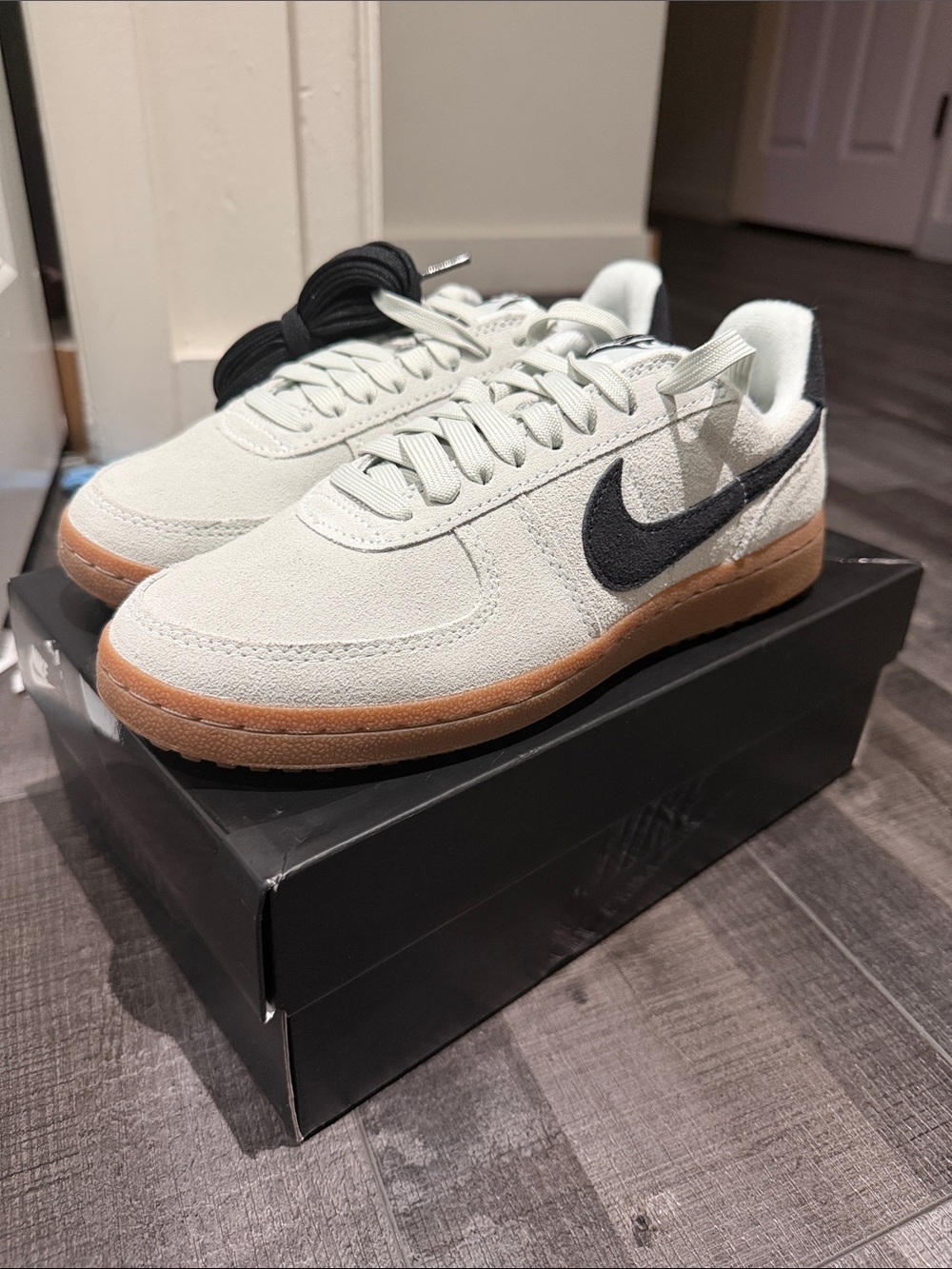 Nike Low-Top Suede Sneakers in Light Gray with Black Swoosh and Gum Sole